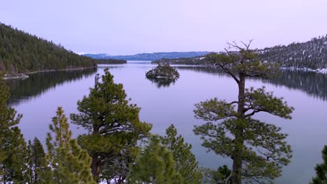 Aerial-flyover-trees-to-reveal-Emerald-Bay,-Lake-Tahoe,-California