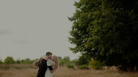 Attractive-Girl-Embracing-Her-Lover-And-Smile-Outdoors-In-Summer-1