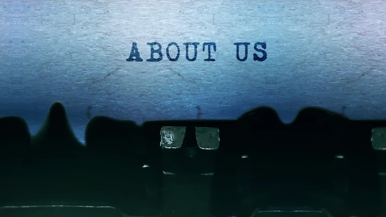 About us word closeup being typing and centered on a sheet of paper on old vintage typewriter