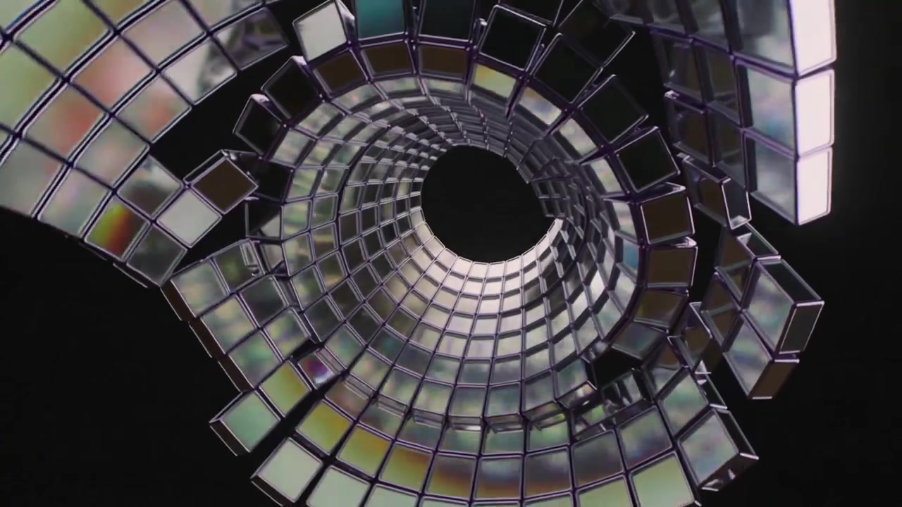 La luce che si sposta fa ruotare un nastro piastrellato, che si ripiega in un vuoto nero a spirale, esponendo una colonna prismatica.