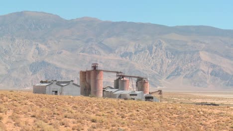 an abandoned mine or factory in the desert