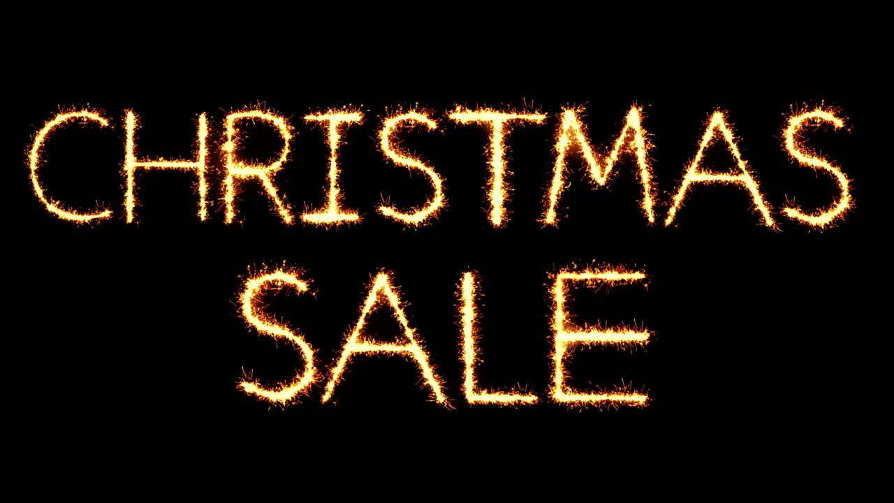 Christmas sale text sparkler writing with glitter sparks particles firework on black 4k loop