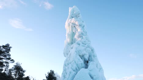 tall iceberg shot from below a cold morning in northern sweden