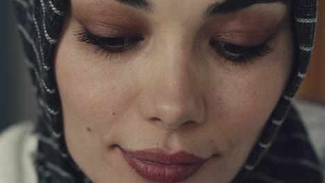 young muslim woman looking at camera