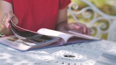 photo album with photo memories in the hands of women