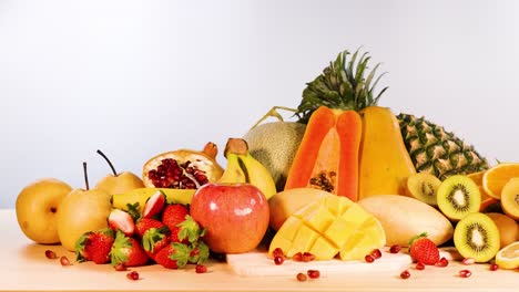 assorted fruits arranged on a white background