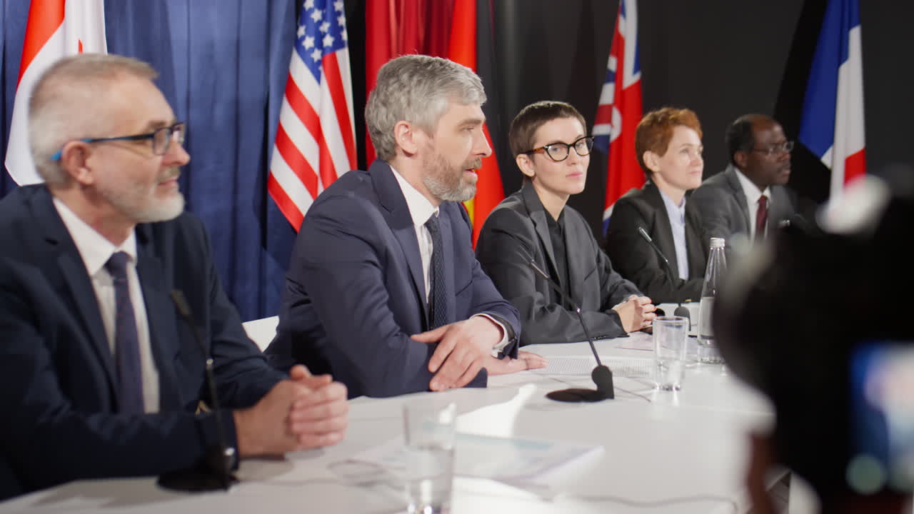 Group of Political Leaders Talking at International Press Conference