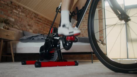 person exercising on indoor cycling machine