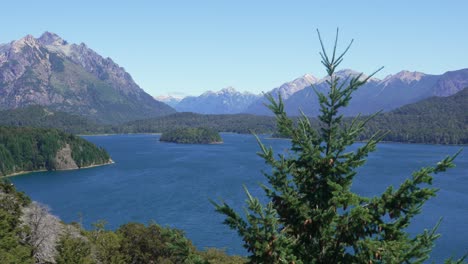 static shot from a viewpoint on circuito chico overlooking lake perito moreno with forests, islands, and the andes mountain range. nahuel huapi national park, bariloche, patagonia, argentina