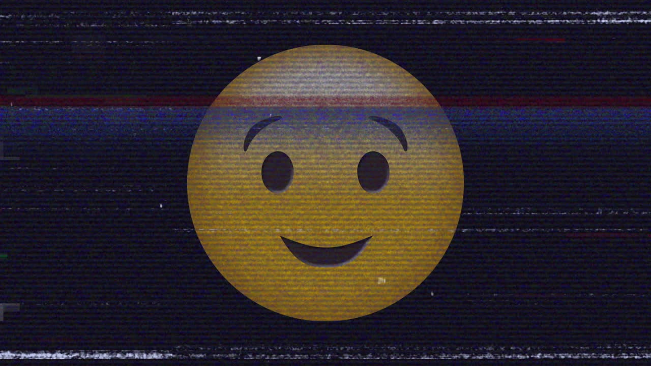 Digital animation of tv static effect over winking face emoji against black background