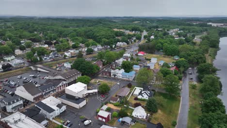 susquehanna river and watsontown, pennsylvania downtown with drone video panning right to left