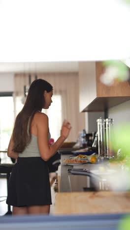 teenage girl cooking in a modern kitchen