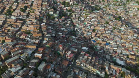 crowded population on mountainside village in medellin, columbia, aerial