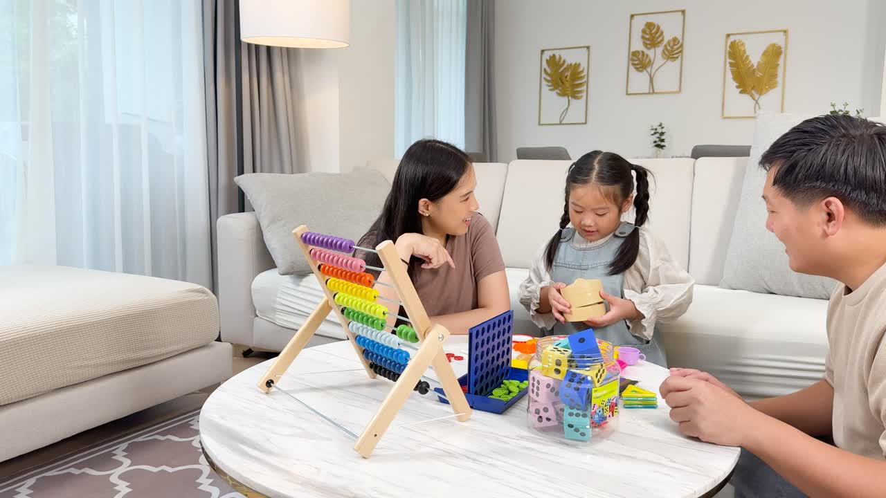 A family enjoys quality time playing with colorful toys in a bright, cozy living room setting