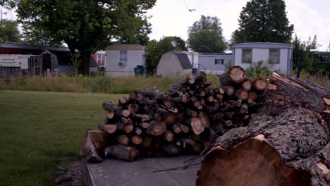 chopped wood sits in trailer park in middle america