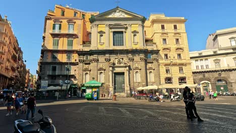 tourists and locals in a bustling naples square