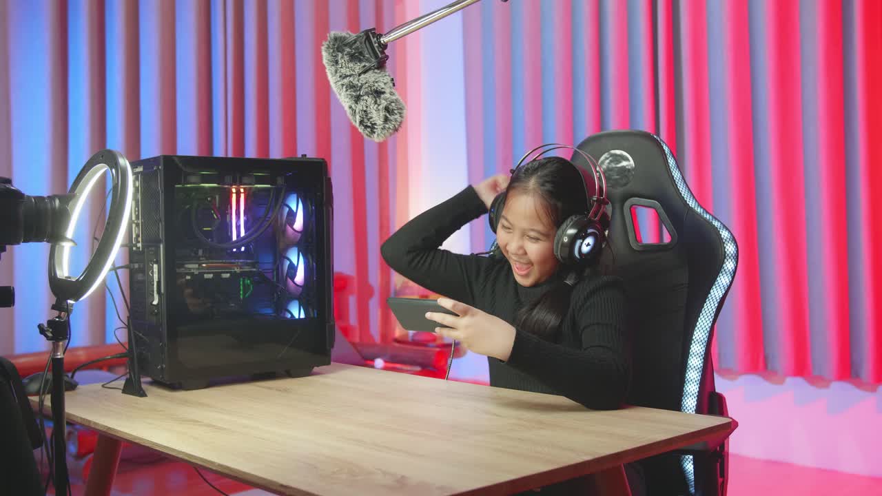 Young Gamer Streaming Mobile Game on a Gaming Setup