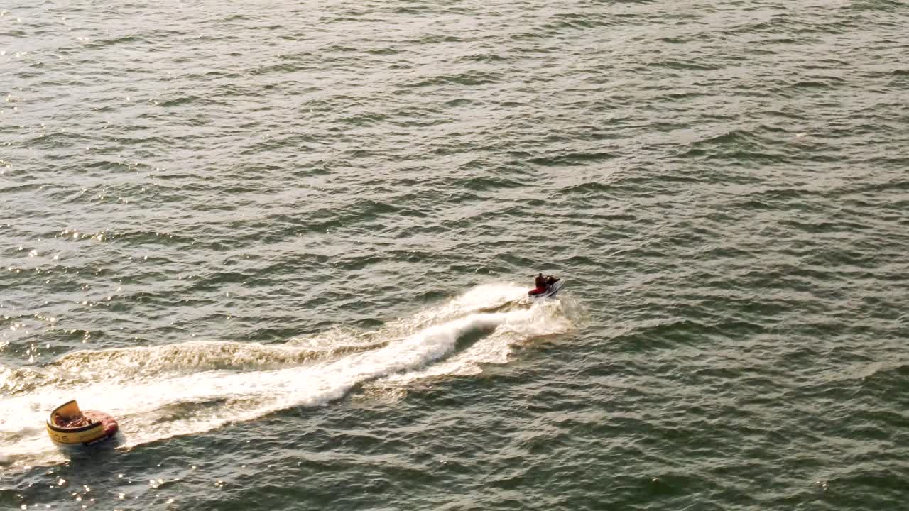 4k cinematic drone stock footage of a person riding a jetski in the Black sea in romania