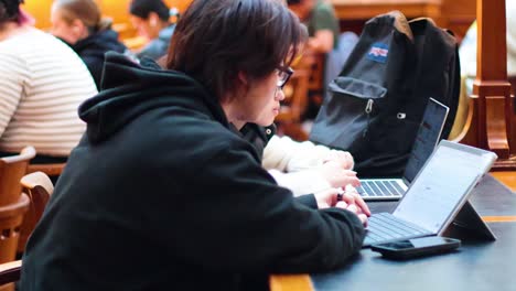 focused individual working on a laptop