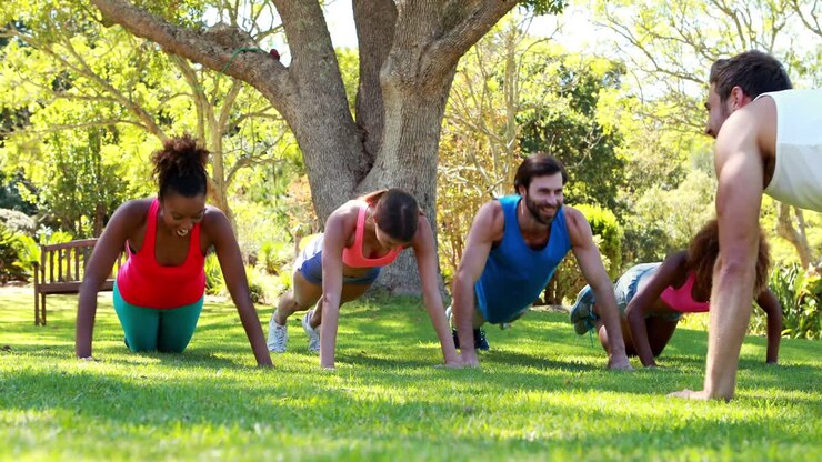 Group of friends doing push ups