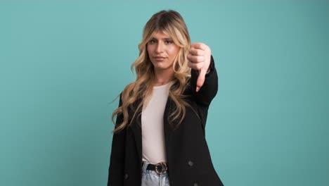 dissatisfied transgender businesswoman looking at camera and showing thumbs down