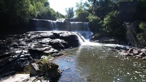 Aerial-flyover-of-the-falls-at-Keuka-Lake-Outlet-Trail-in-Penn-Yan,-NY-in-the-Finger-Lakes-region