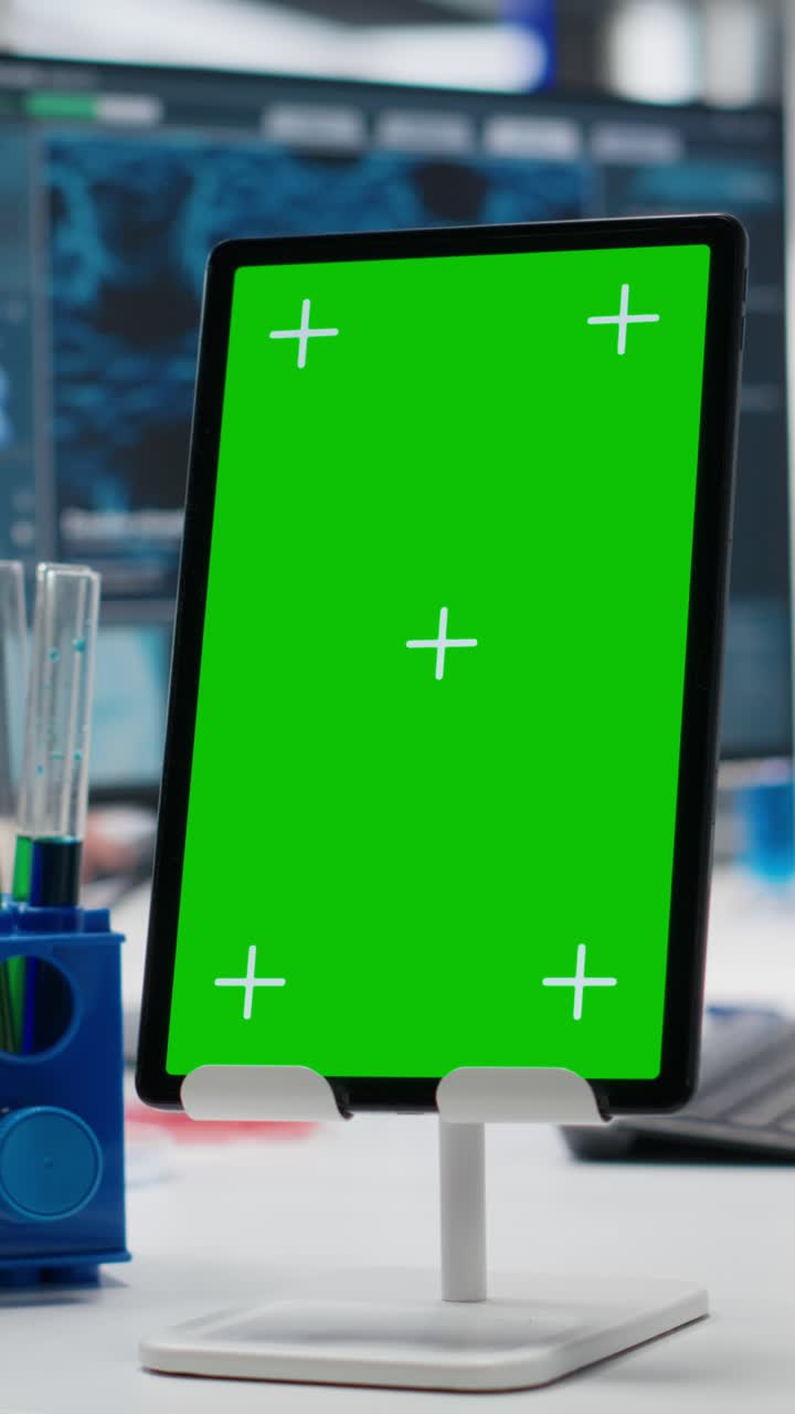 Vertical video Lab engineer using isolated screen tablet for DNA data analysis