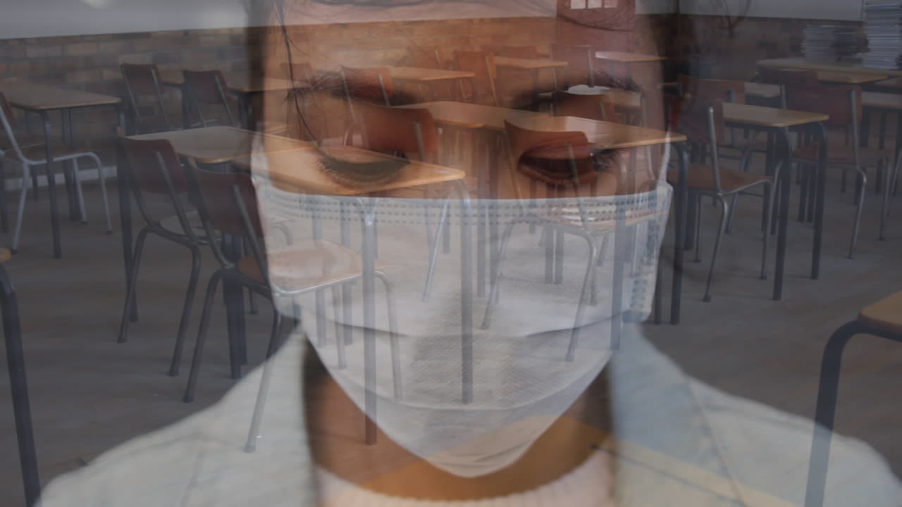 Woman in face mask against empty classroom