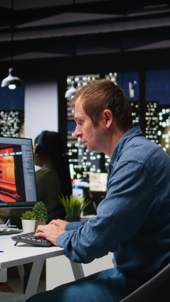 Vertical Video Male IT engineer uses AI techniques to create video game and a turbine