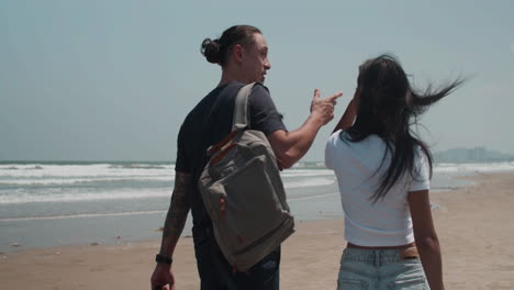 Couple-walking-on-the-beach