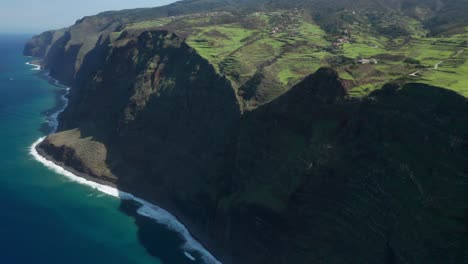 jurassic park like cliffs on northern side of madeira seen from above, aerial