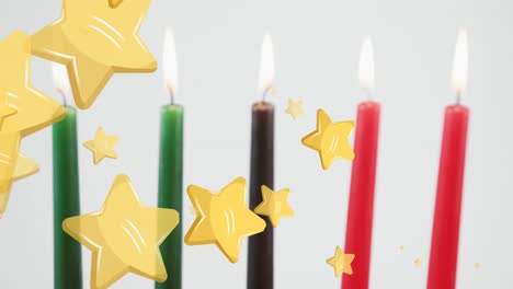 animation of golden stars falling over kwanzaa candles on grey background