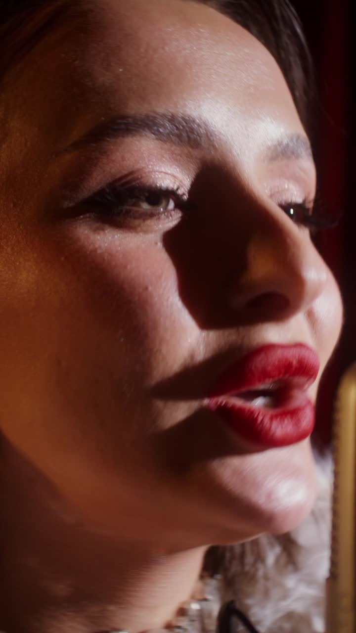 Close-up of a Woman Singing into a Microphone