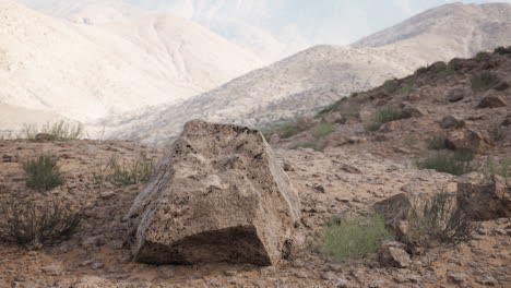 large rock in a desert landscape