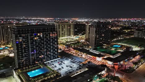 aerial nightlife district in doral, florida with colorful illuminated street