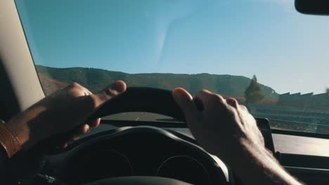 Point-of-view,-Driving-on-the-highway-at-a-sunny-day