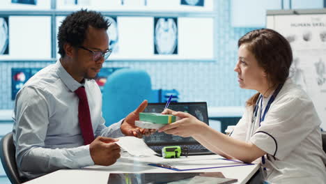woman physician offering drugs and painkillers on prescription medicine