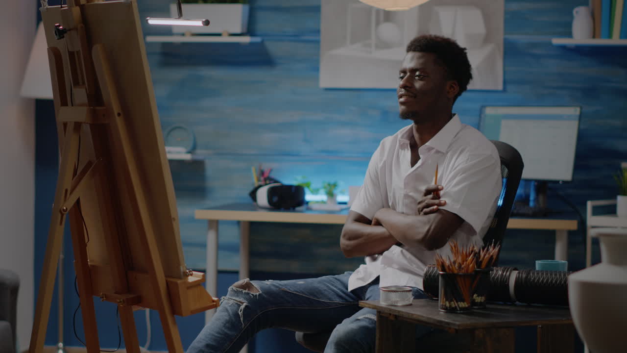 Adult of african american ethnicity designing vase on canvas