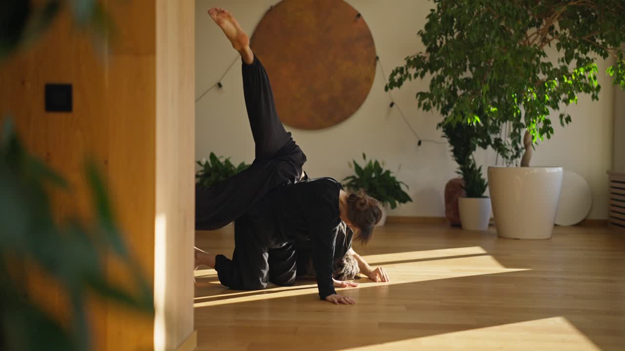 Two people practicing yoga and contemporary dance