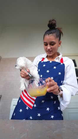 woman cooking with dog in the kitchen