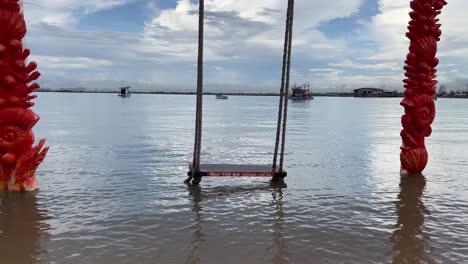 high tide sea view with a beach seesaw on the water