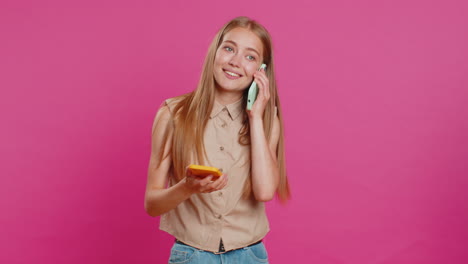 irritated stressed business woman talking on two mobile phones having conversation conflict quarrel