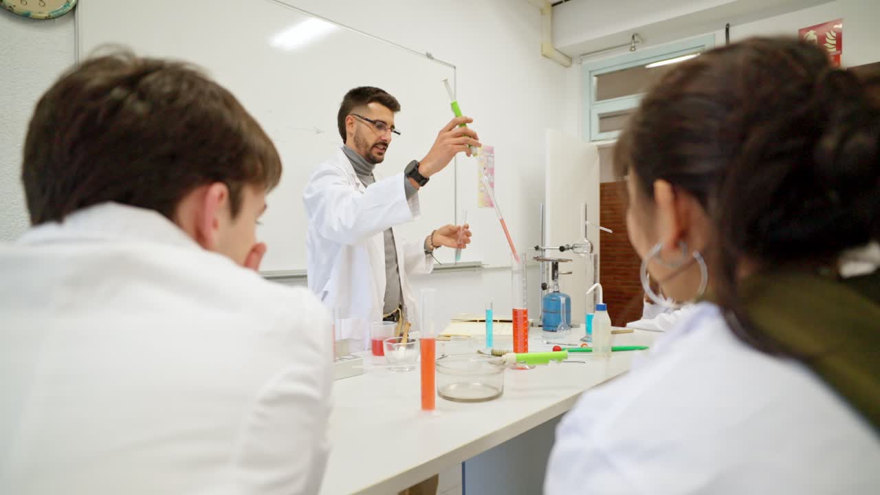 Science experiment in a laboratory with students and teacher