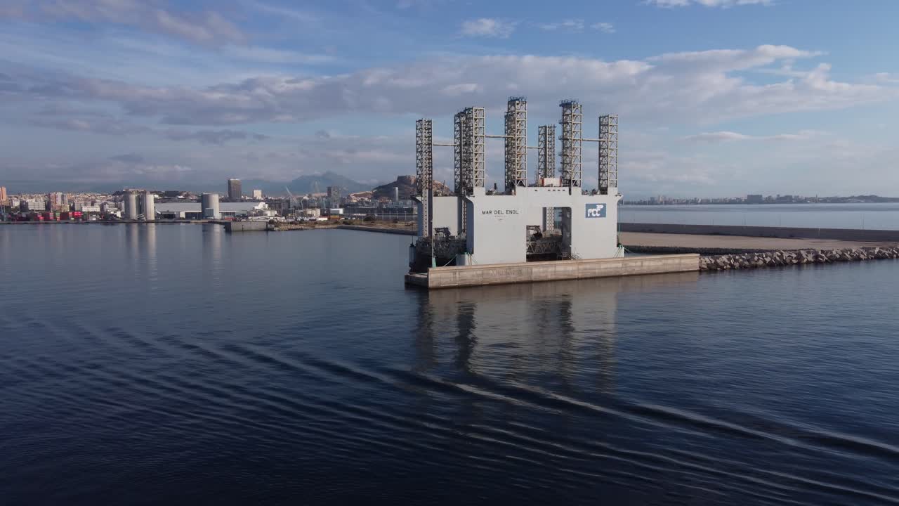 Orbiting around the floating concrete factory "Mar del Enol" and industrial port
