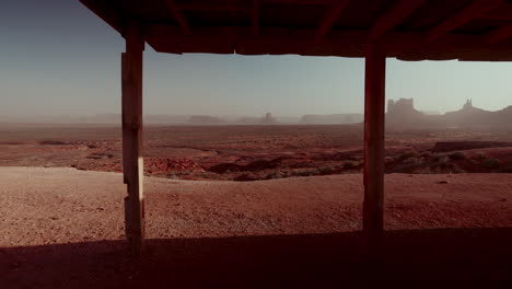 desert landscape under a wooden shelter at sunrise/sunset