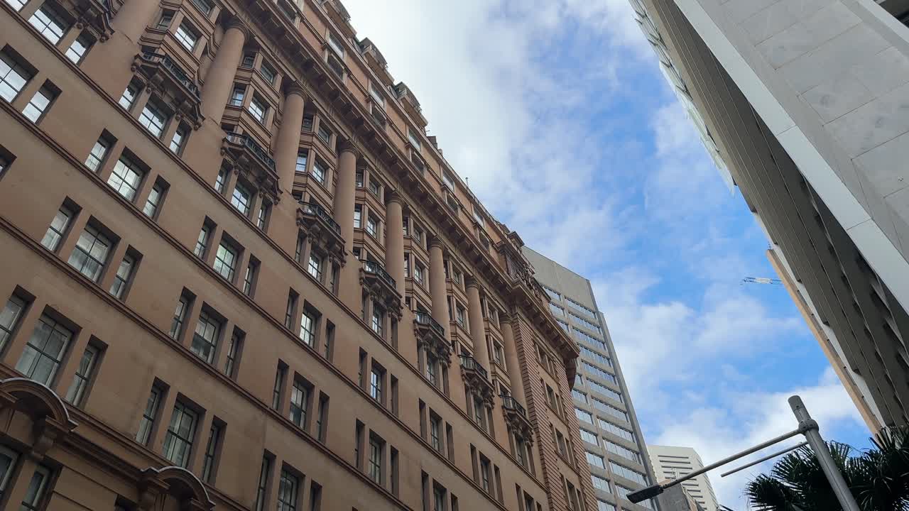 Sydney wide brown stone building oblique low angle blue sky city NSW Australia