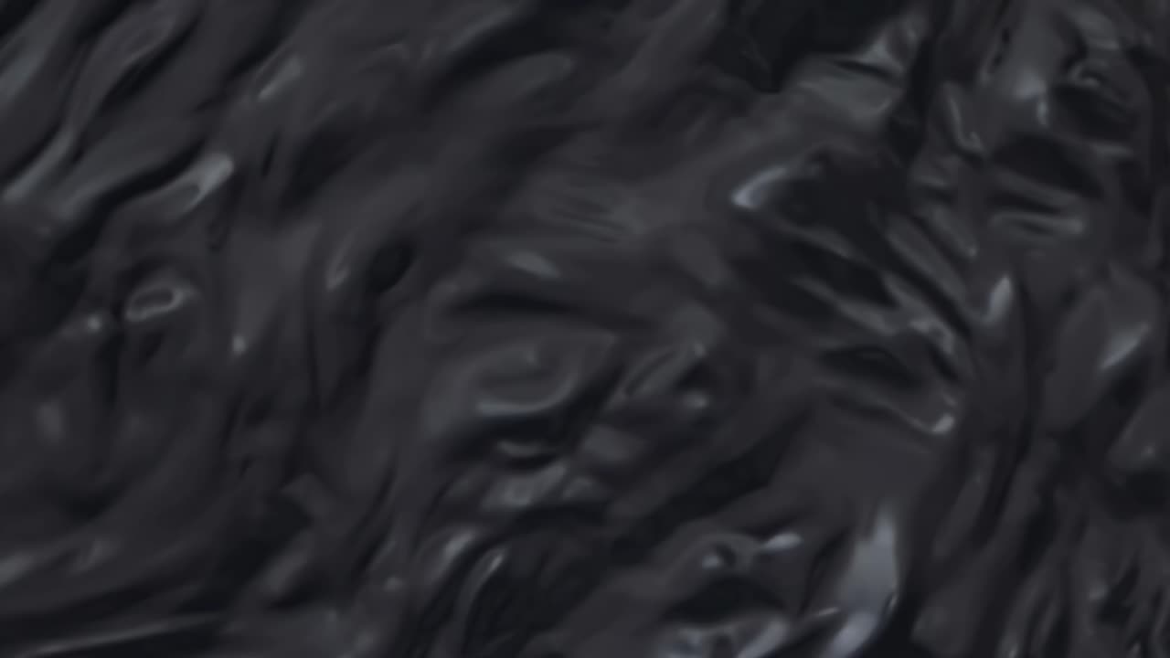 Smooth, undulating folds of dark, viscous substance create an intricate, abstract pattern, inviting exploration and sparking curiosity while evoking a deep sense of mystery and allure