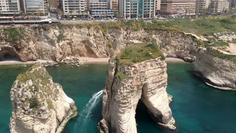 Overtake-shot-Of-Big-Pigeon-Rocks-In-Rawshe-Coastline,-Beirut-City-,-Lebanon