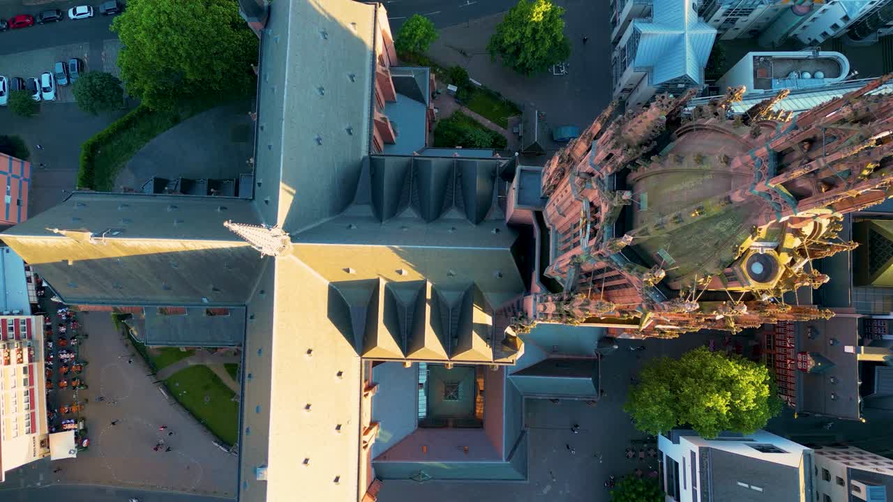4K Drone Video of the Gothic-Style Kaiserdom St. Bartholomäus Cathedral near the Römerberg Market Square on the Main River in Downtown Frankfurt, Germany