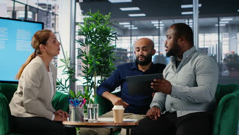 vertical video office meeting featuring diverse professionals engaged in company planning